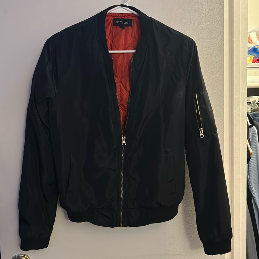 Black coat size medium from rainbow clothing store three pockets